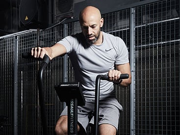 Man exercising on an air bike