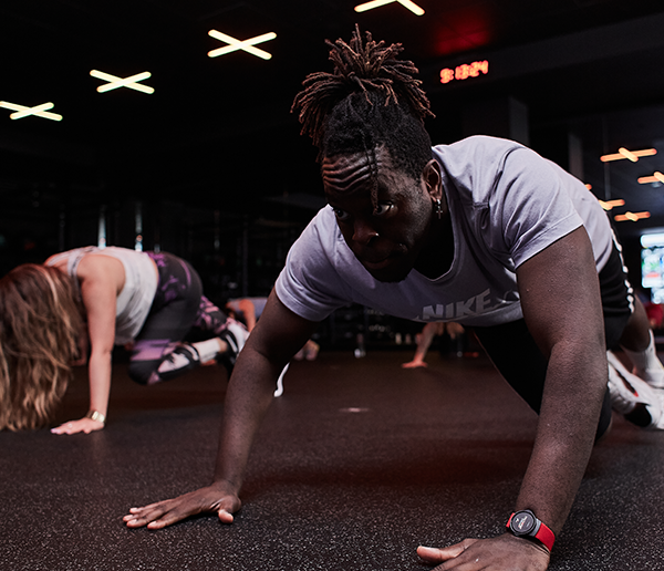 Man performing bodyweight exercises in the gym