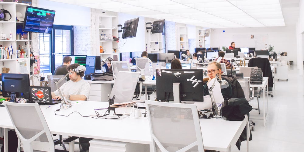 Busy office space with employees working at desks