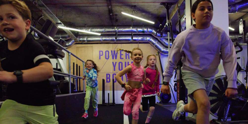 Children running in a gym