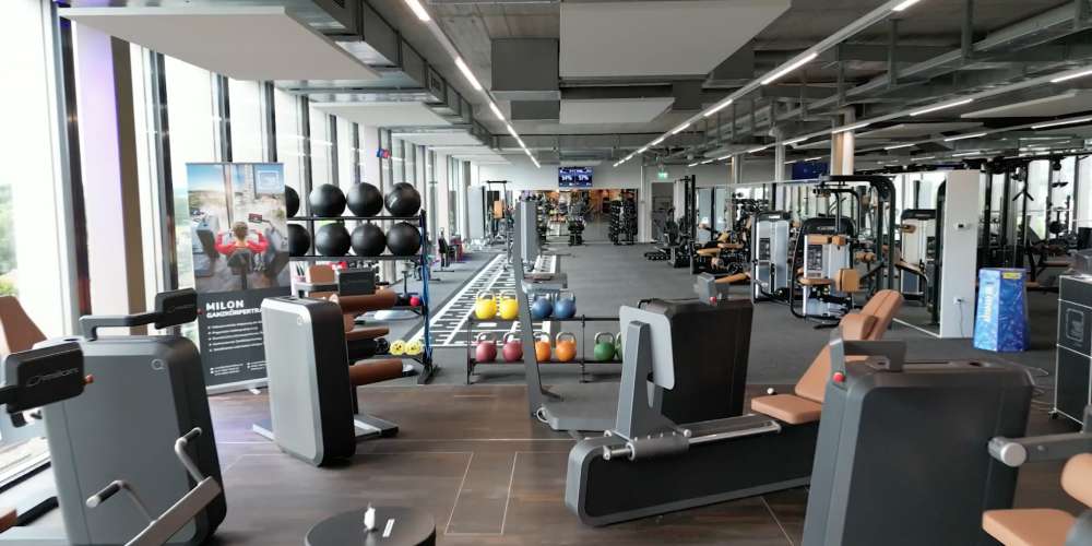 PRIME TIME fitness gym space, with exercise machines and free weights