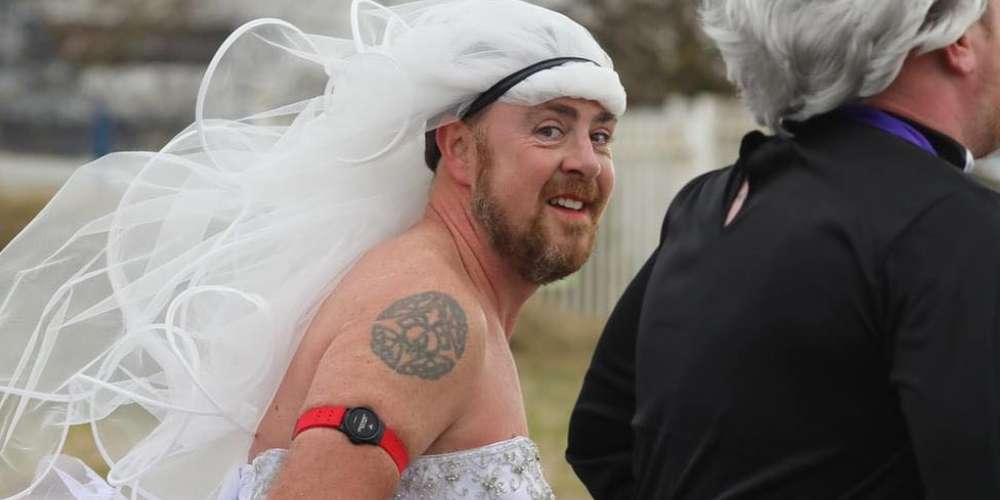 Richard Moore running a 10k in full wedding dress, raising money for Southport Saviours charity