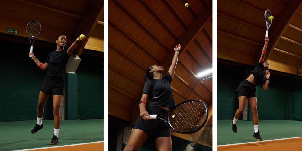 Zeniece Hall performing a tennis serve