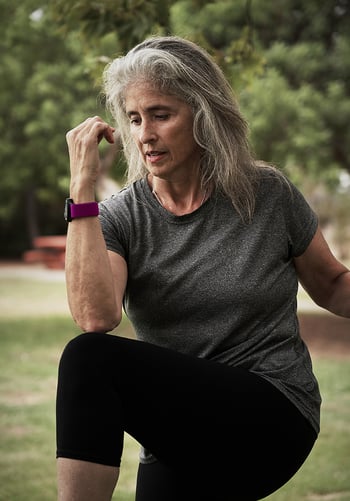 A woman exercising outside