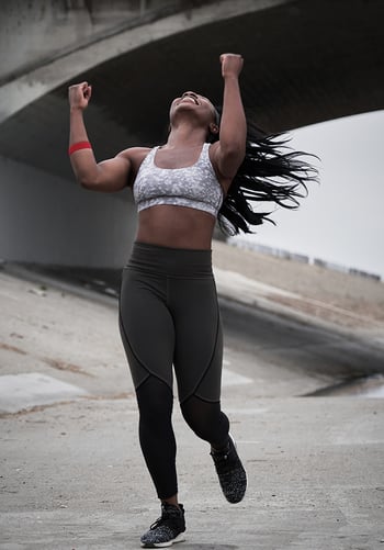 A women celebrating outdoors