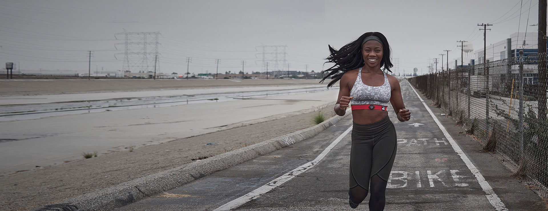 Woman running with a Myzone