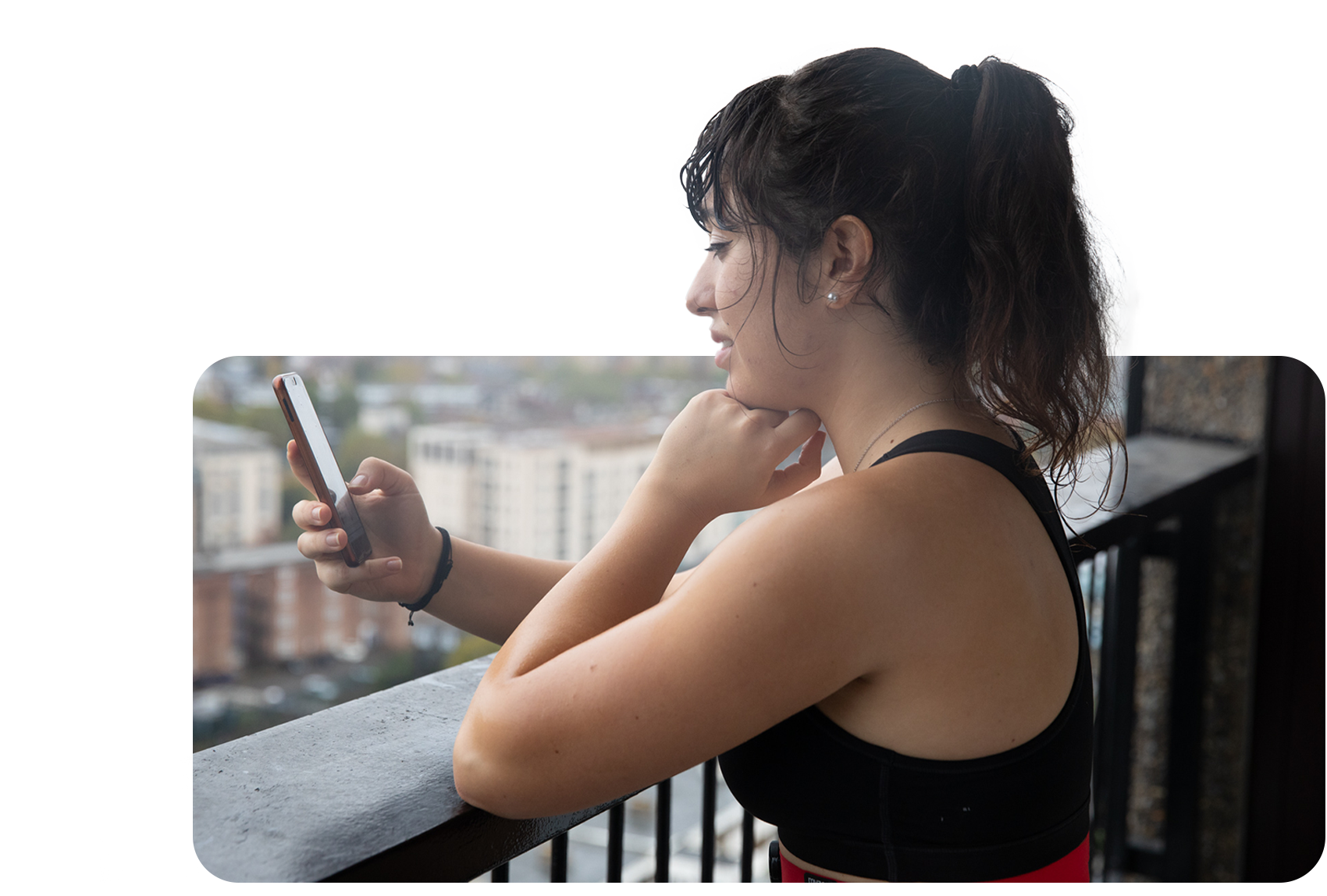 Woman outside looking at the Myzone app