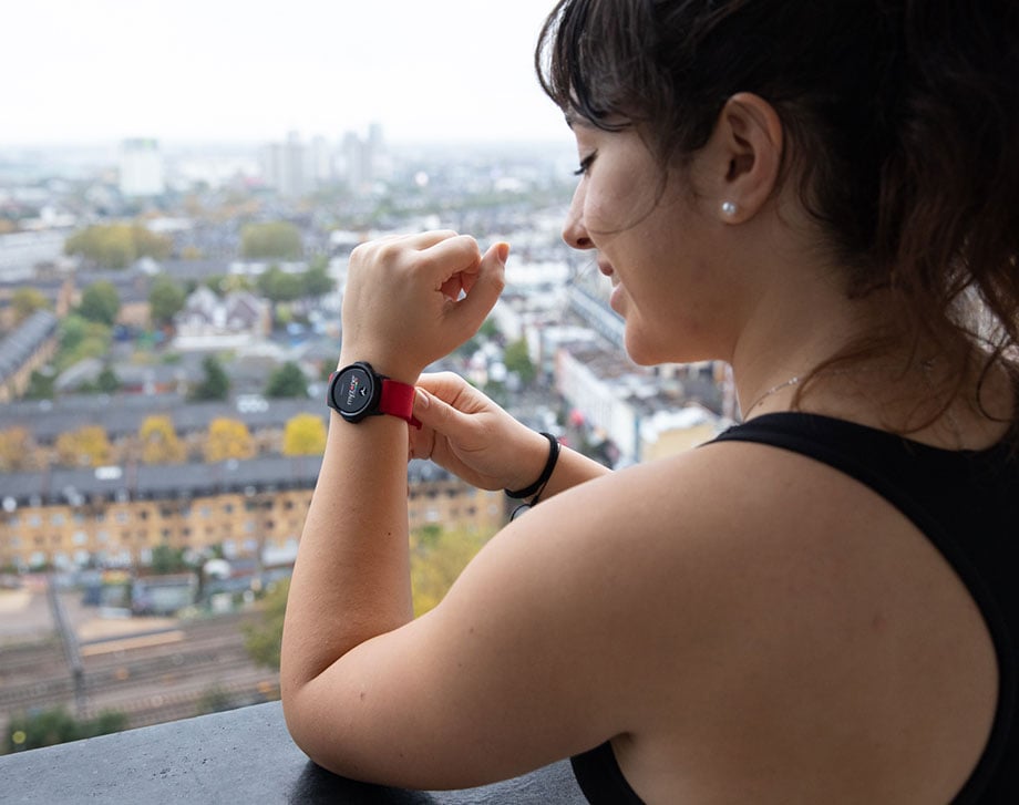 Woman putting on a Myzone heart rate monitor