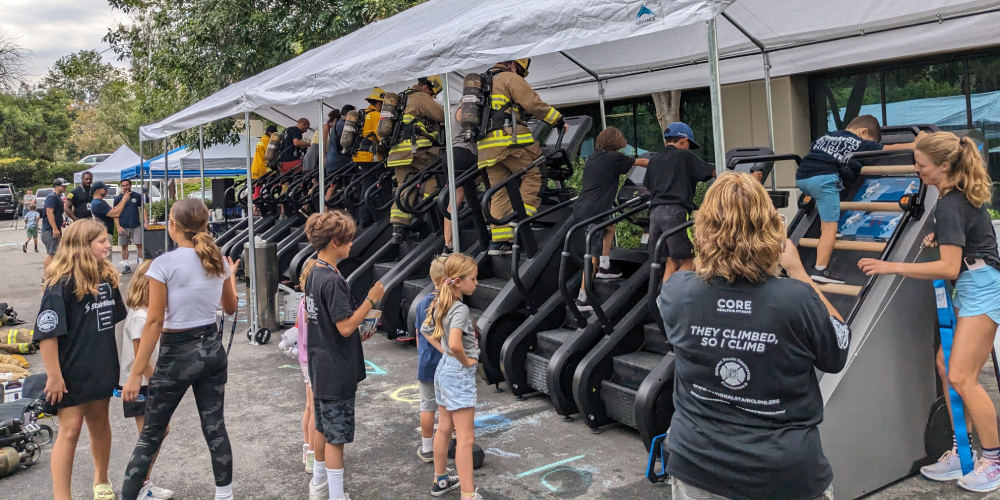 Firefighters, friends, and family taking part in the 9/11 memorial stair climb with Core Health & Fitness and Myzone