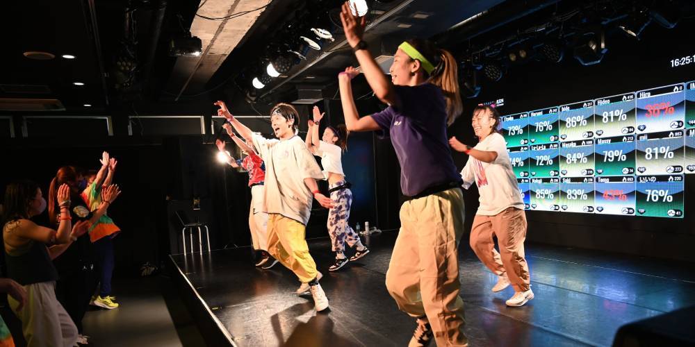An exercise class in Japan, with a group of trainers motivating the gym class members using Myzone