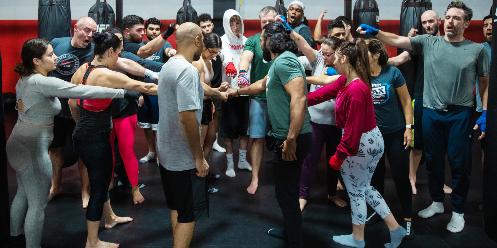 A gym community congratulating each other after a challenging workout