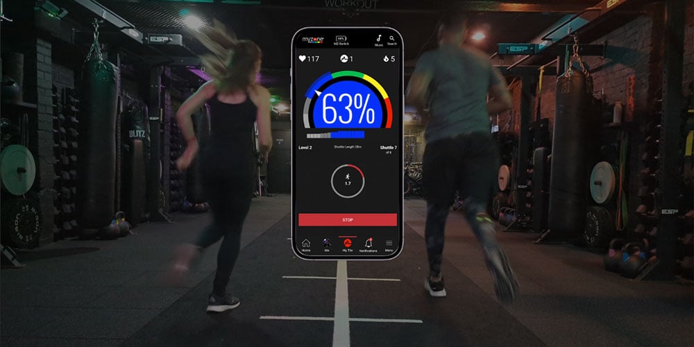 A woman and a man performing a beep test, with the Myzone app illustration between them