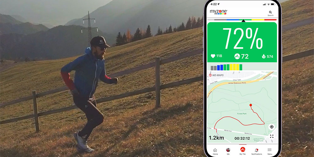 Man running outside with the Myzone app displaying his route map and effort