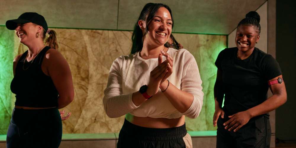 Dance teacher, Shanika Trotman, in a studio with two other class participants