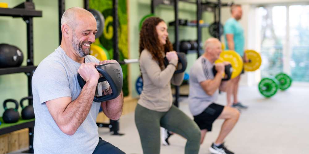 Thrive gym members in an group personal training exercise class