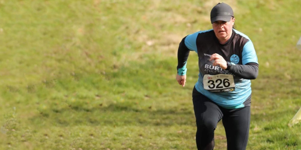 Woman running as part of University Hospitals of Derby and Burton NHS Foundation Trust Myzone pilot